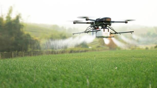 Agricultural drone spraying crops